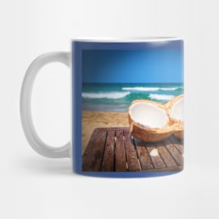 Coconut on the table against beautiful beach Mug